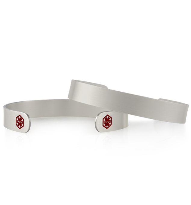 2 Sleek Mini Med ID Cuffs in Silver. 2 silver tone metal cuffs with smooth brushed surface both sides, red caduceus each end