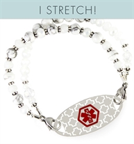 Double strands of Moonstone and white jade beads with sterling silver and crystal beads attached to silhouette medical ID tag