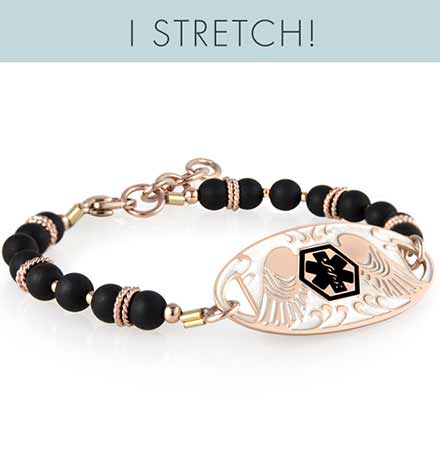 Nora bracelet made of black beads with rose gold accents attached to rose tone guardian angel medical ID tag